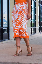 Load image into Gallery viewer, IRIS WRAP MIDI SKIRT- ORANGE ANIMAL PRINT
