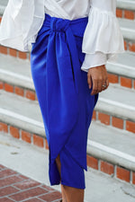 Load image into Gallery viewer, ZOEY SATIN MIDI SKIRT WITH FRONT KNOT- ROYAL BLUE
